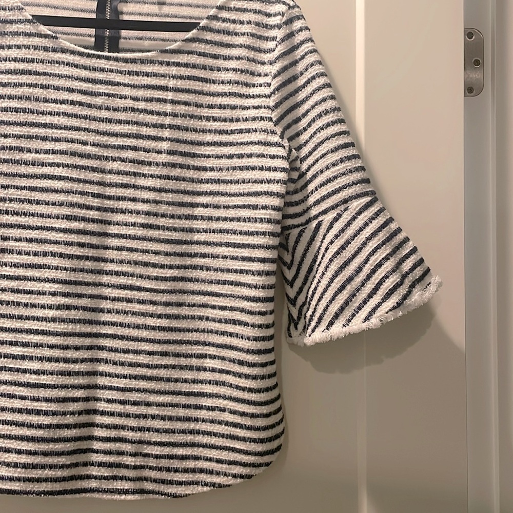 Striped flutter sleeve top.